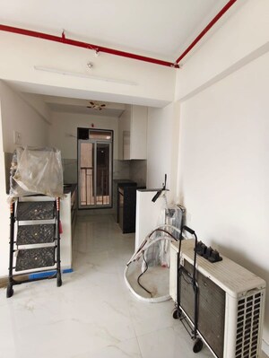 Living Room in 1 BHK Apartment at Metropolis Bayside, Kasarvadavali – for Rent