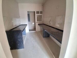 Kitchen in 3 BHK Apartment at Aryavart Star Altair, Bhugaon – for Rent