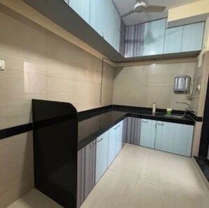 Kitchen in 1 BHK Apartment at Pancsheel CHS, Malad East – for Rent