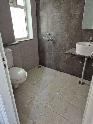Bathroom in 3 BHK Apartment at Artique Uptown Skylla, International Airport Road – for Rent