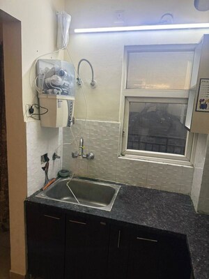 Kitchen in 2.5 BHK Apartment at Supertech Livingston, Sain Vihar – for Sale