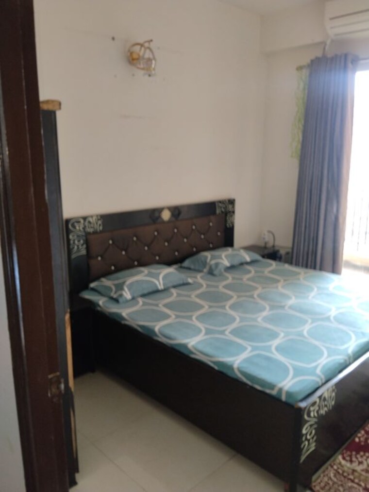 Bedroom, signature-global-the-roselia 2 Bedroom 970 Sq.Ft. Apartment In Sector 95a Gurgaon 10709963
