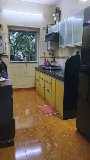 Kitchen in 3 BHK Apartment at Riddhi Gardens CHS, Malad East – for Rent
