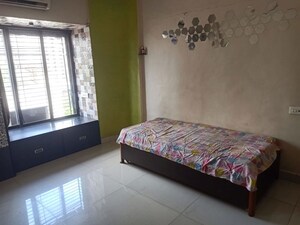 Bedroom in 2 BHK Apartment at Lokpuram CHS, Vasant Vihar – for Rent