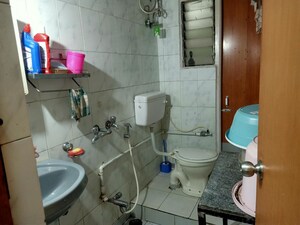 Bathroom in 2 BHK Apartment at Hyde Park Galaxy, Manpada – for Rent