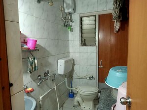 Bathroom in 2 BHK Apartment at Hyde Park Galaxy, Manpada – for Rent