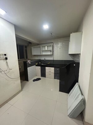 Kitchen in 2 BHK Apartment at Renuka Gulmohar C Building CHS, Pimpri – for Rent