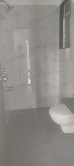 Bathroom in 1 BHK Apartment at Anant Metropolis Insignia Towers, Kasarvadavali – for Rent