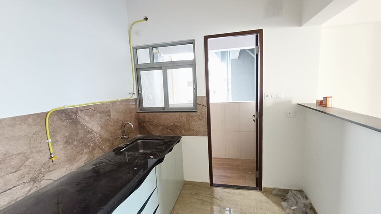 Kitchen, kolte-patil-life-republic-aros 3 Bedroom 1058 Sq.Ft. Apartment In Hinjewadi Pune 10711531