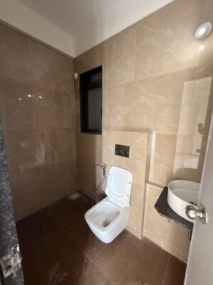 Bathroom in 2 BHK Apartment at Dhamji Shamji Mahavir Spring Tulip Phase 1, Pokhran Road No Two – for Rent