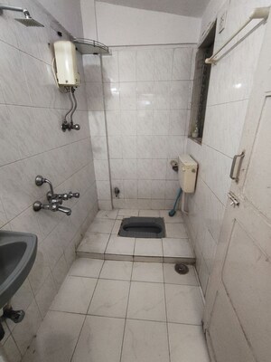 Bathroom in 1 BHK Apartment at Dheeraj Kirti, Malad West – for Rent