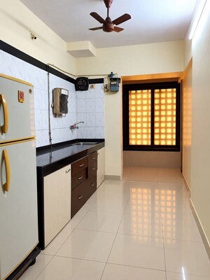Kitchen in 2 BHK Apartment at Laxmi Madhuvan, Malad East – for Rent