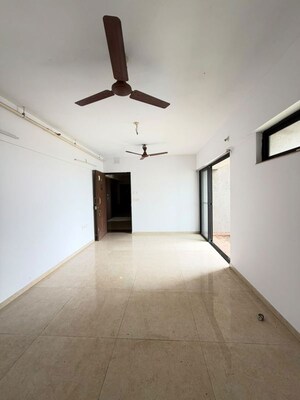 Living Room in 2 BHK Apartment at Lodha Palava Downtown, Dombivli East – for Sale