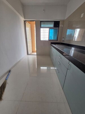 Kitchen in 2 BHK Apartment at Cosmos Habitat, Majiwada – for Rent