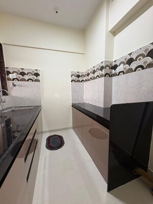 Kitchen in 2 BHK Apartment at Vedant Sumeet Elite, Balkum Pada – for Rent