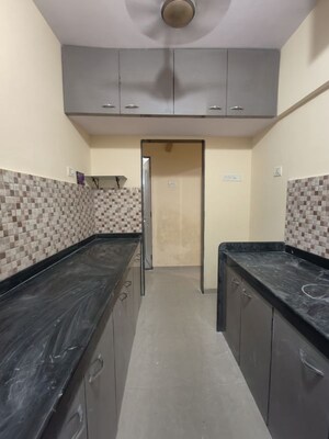 Kitchen in 1 BHK Apartment at Hubtown Greenwoods D Wing, Vartak Nagar – for Rent