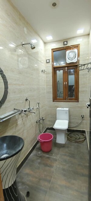 Bathroom in 4 BHK Builder Floor at Dwarka Mor – for Rent