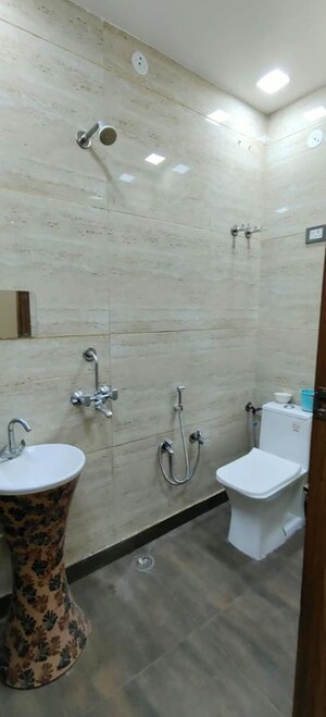 Bathroom in 4 BHK Builder Floor at Dwarka Mor – for Rent