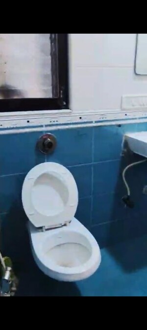 Bathroom in 2 BHK Apartment at Wood Rose CHS, Andheri West – for Rent