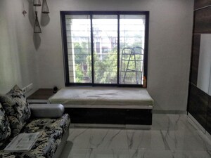 Living Room in 1 BHK Apartment at Rohan Garden, Kothrud – for Rent