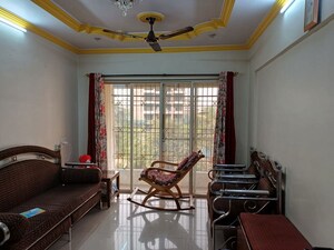 Living Room in 1 BHK Apartment at Laxmi Kailash Garden , Kalyan West – for Sale