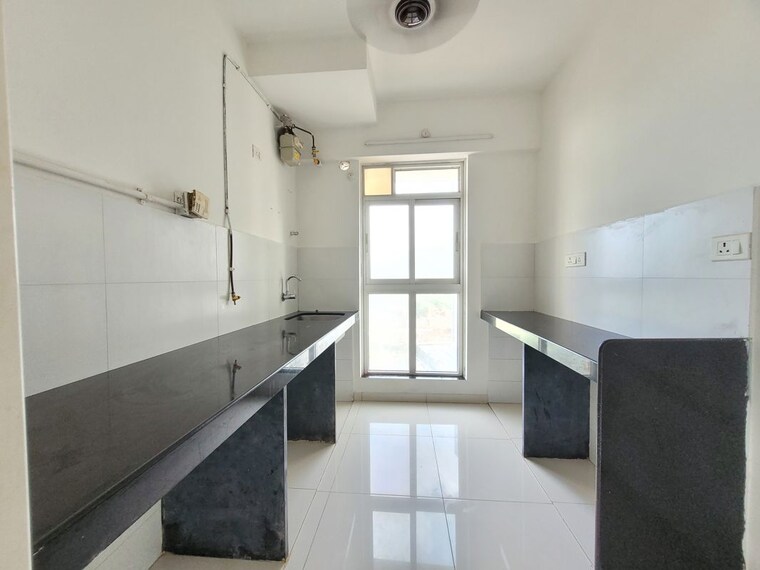 Kitchen, godrej-emerald 1.5 Bedroom 750 Sq.Ft. Apartment In Ghodbunder Road Thane 10714907