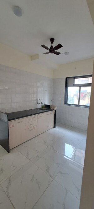 Kitchen in 1 BHK Apartment at Pranjee Garden City, Katrap – for Sale