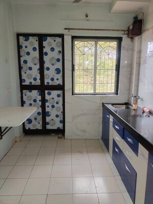 Kitchen in 1 BHK Apartment at Vijay Nagari Annex, Waghbil – for Rent