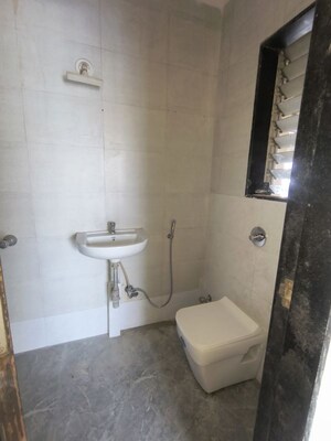 Bathroom in 2 BHK Apartment at Kakad Paradise Phase 1, Mira Road – for Rent