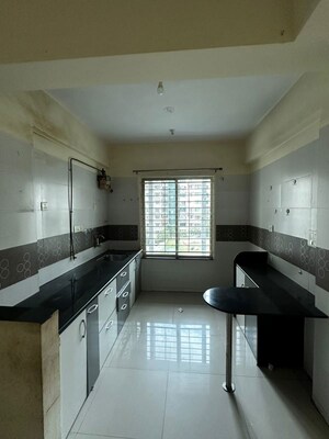 Kitchen in 2 BHK Apartment at The Rao Heights, Moshi – for Rent