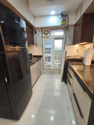 Kitchen in 2 BHK Apartment at Andheri CHS, Andheri West – for Rent