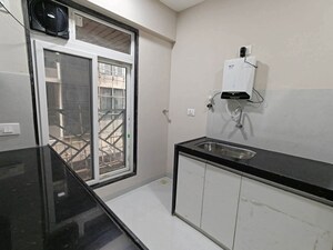 Kitchen in 2 BHK Apartment at Bandstand Apartment, Bandra West – for Rent
