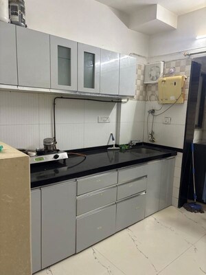 Kitchen in 2 BHK Apartment at Goyal Green Woods, Andheri East – for Rent