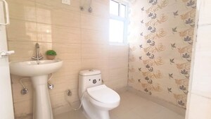 Bathroom in 2 BHK Apartment at Milan Earth, Raj Nagar Extension – for Sale