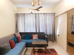Living Room in 2 BHK Apartment at Nilanjana CHS, Malad West – for Rent