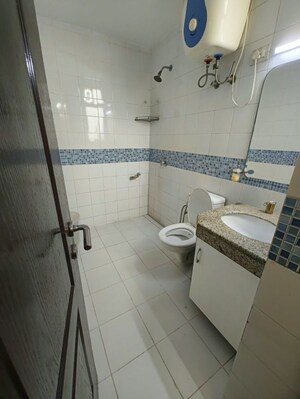 Bathroom in 3 BHK Apartment at Unitech Uniworld Gardens 2, Sector 47 – for Rent