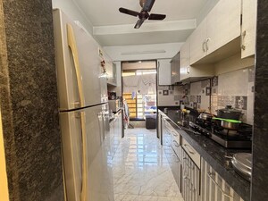 Kitchen in 2 BHK Apartment at Omkar Om Residency, Parel – for Sale