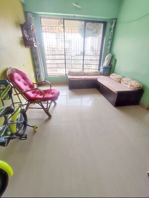 Living Room in 1 BHK Apartment at Kavya Hill View CHS, Anand Nagar – for Sale
