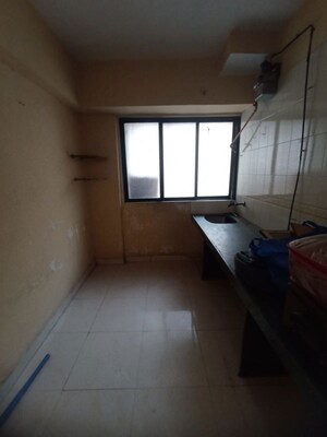 Kitchen in 2 BHK Apartment at Arihant Plaza CHS, Owale – for Rent