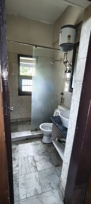 Bathroom in 3 BHK Builder Floor at Omaxe Designer Villas Mayfield Garden, Sector 51 – for Rent