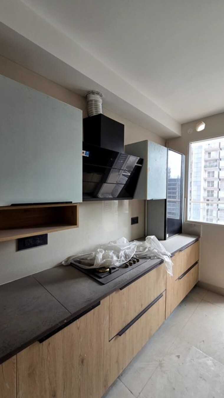 Kitchen, the-ananta-aspire 3 Bedroom 1843 Sq.Ft. Apartment In Utrathiya Zirakpur 10719285