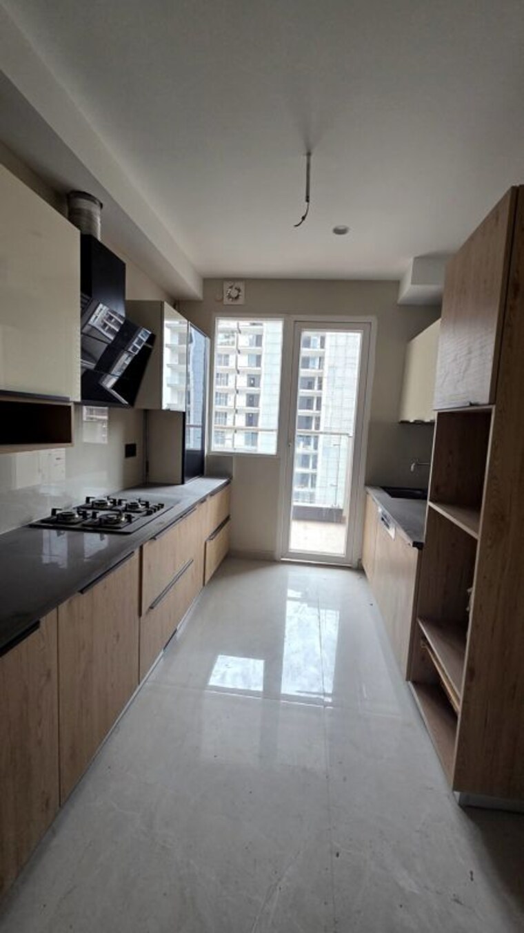 Kitchen, the-ananta-aspire 3 Bedroom 1843 Sq.Ft. Apartment In Utrathiya Zirakpur 10719316