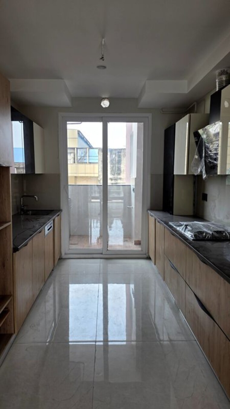 Kitchen, the-ananta-aspire 3.5 Bedroom 2247 Sq.Ft. Apartment In Utrathiya Zirakpur 10719680