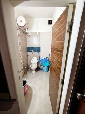 Bathroom in 2 BHK Apartment at Rustomjee Paramount, Khar West – for Rent
