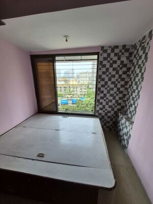 Bedroom in 2 BHK Apartment at Kamal Van CHS, Kandivali West – for Sale