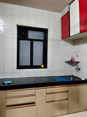 Kitchen in 2 BHK Apartment at Gauri Shankar CHS, Dombivli West – for Rent