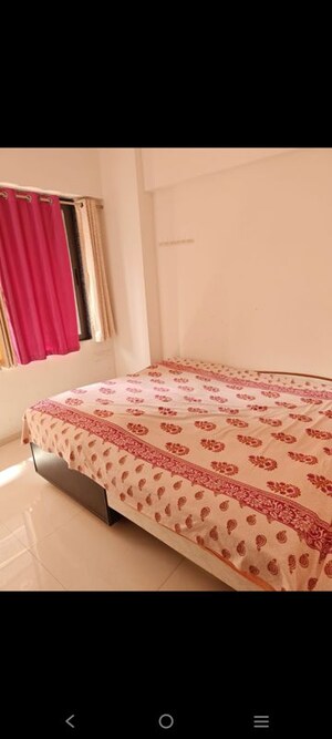 Bedroom in 2 BHK Apartment at Pavanj Parmeshwar Nilayam, Tragad – for Rent