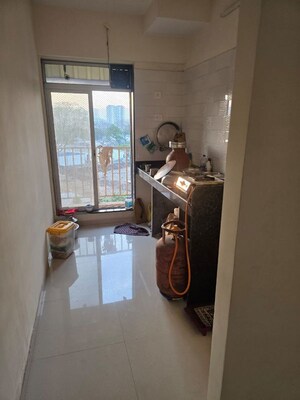 Living Room in 1 BHK Apartment at Sunrise Glory, Shilphata – for Rent