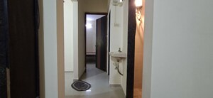 Building Lobby in 1.5 BHK Apartment at Dev Shrushti CHS, Kharghar – for Sale