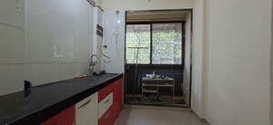 Kitchen in 1.5 BHK Apartment at Dev Shrushti CHS, Kharghar – for Sale